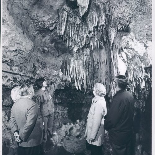 Vintage Photo of the some Guests with a Tour Guide in Cathedral Room inside the cave.